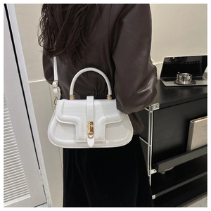Rear view of model wearing a white PU leather saddle bag with gold metal buckle