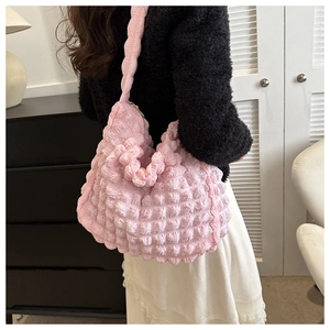 Pink bubble texture tote bag shown over the shoulder for size and capacity detail