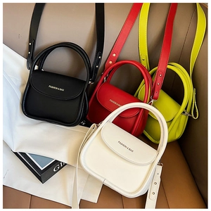 Detailed view of fashionable PU leather crossbody bags in black, red, green and white colors