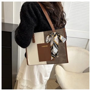Detail shot of tricolor leather tote bag with silk scarf and FASHION pocket on model