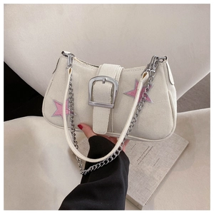 Detail of canvas underarm bag with silver buckle and pink star patch embroidery