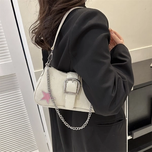 Chic beige canvas underarm bag with pink star embroidery and silver buckle on model