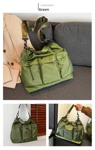 Detail of green puffy nylon crossbody bag featuring multi-pocket design and adjustable strap