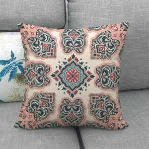 Linen decorative pillow cover featuring a bohemian mandala pattern on a fabric sofa