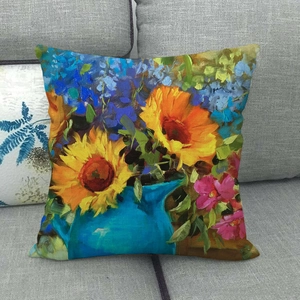 Dettaglio della trama in lino e del dipinto a olio di girasole sulla fodera del cuscino