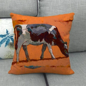 Detail of artistic oil painting cow print on orange linen square decorative sofa pillowcase