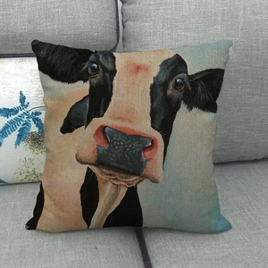 Artistic oil painting cow pattern linen pillowcase displayed on a grey sofa couch