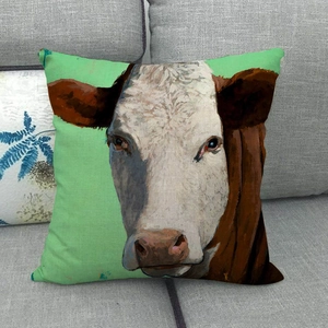 Detail of oil painting cow pattern on linen throw pillow case with textured fabric