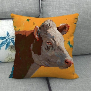 Macro detail of cow oil painting print on rustic linen throw pillow cover on sofa