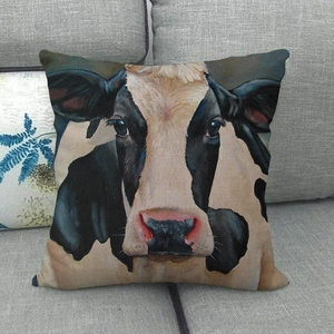 Detail of artistic oil painting cow pattern on textured linen sofa cushion cover