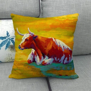 Detailed texture of linen throw pillow case featuring an oil painting cow pattern