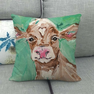 Linen pillow cover featuring a cow oil painting pattern on a grey sofa background
