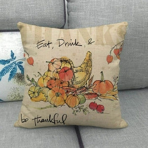 Detail of linen pillowcase with harvest pumpkins and Eat Drink and be thankful text