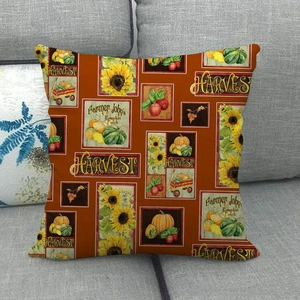 Detail of harvest pumpkin and sunflower print on rustic linen-style throw pillow cover