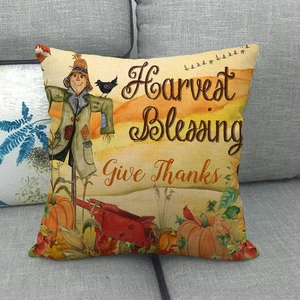 Pastoral pumpkin linen pillowcase with Harvest Blessing print on a grey sofa