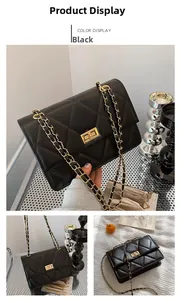 Détail du sac bandoulière noir matelassé avec fermoir doré et bandoulière chaîne