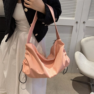 Pink large capacity crescent shoulder bag with side drawstring detail for casual wear