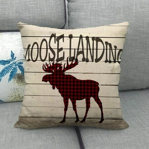 Housse de coussin en lin avec texture bois et motif silhouette d'élan à carreaux