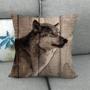 Linen cushion cover with realistic grey wolf sketch on rustic wood grain background