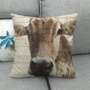 Detailed realistic cow portrait print on a rustic wood-style linen throw pillowcase