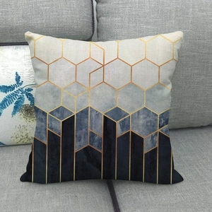 Linen pillow cover with geometric hexagonal gradient pattern and elegant gold accents