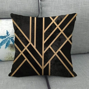Macro detail of high-quality linen cushion cover with gold geometric lines on black fabric