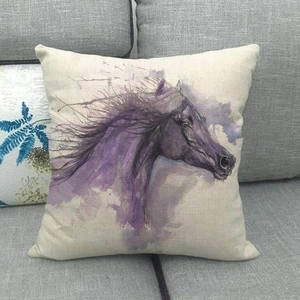 Detailed texture of linen cushion featuring a purple watercolor horse art on a sofa