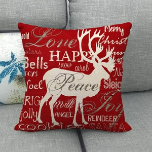 Christmas red linen pillow cover with white reindeer silhouette and festive typography