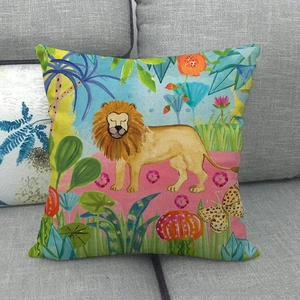 Detail of linen cushion cover featuring a colorful cartoon lion and jungle botanical print
