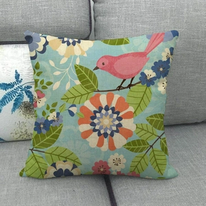 Close-up of bird and floral print pattern on square cotton linen throw pillow cover