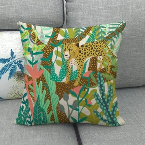 Detail of linen pillowcase featuring a hand-painted jungle leopard and botanical pattern