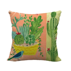 Linen cushion cover with bird and cactus illustration on pink and green background