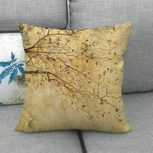Square linen throw pillow cover with autumn leaves oil painting pattern on a grey sofa