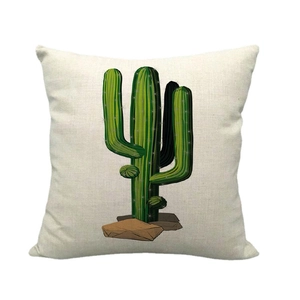 Housse de coussin en lin avec motif cactus vert sur un fond blanc épuré