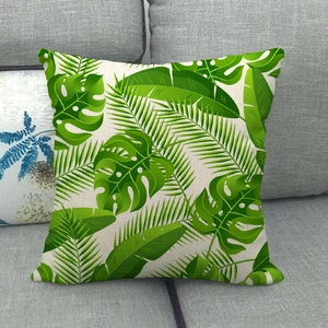 Détail du motif de feuilles tropicales sur la texture de la taie d'oreiller en lin
