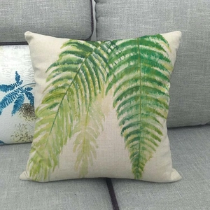 Détail du motif de feuilles vertes à l'huile sur la taie d'oreiller en lin mélangé