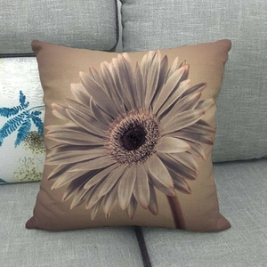 Close-up of the detailed linen fabric texture and daisy flower print on the pillowcase