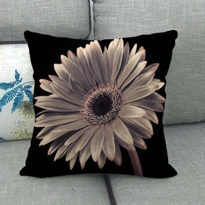 Macro shot of realistic daisy flower petal print on black square linen pillowcase
