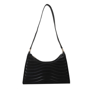 Minimalist black quilted hobo shoulder bag with wavy texture and sleek curved top edge