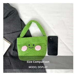 Size comparison showing a mini green plush teddy bag next to a smartphone