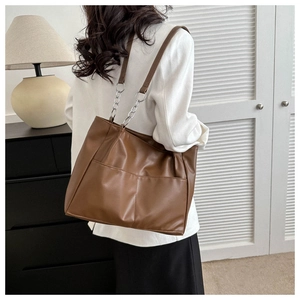 Brown PU leather tote bag with front pockets and silver chain shoulder strap details