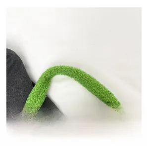 Detail of soft green faux shearling texture and comfortable handle of the plush handbag