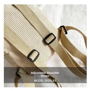 Detail of beige corduroy backpack with adjustable shoulder straps and durable buckles