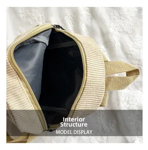 Detailed interior view of a corduroy small backpack with zipper closure and black lining