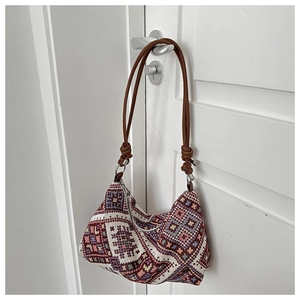 Ethnic style canvas shoulder bag with colorful geometric jacquard and brown leather strap