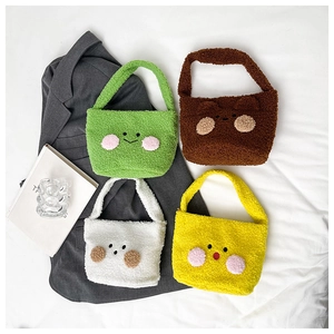 Detailed view of plush teddy faux fur tote bags in green, brown, white, and yellow colors