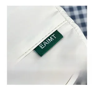 Macro shot of durable white nylon fabric with EAIMT brand label and neat stitching