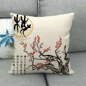 Close-up of linen pillowcase with traditional Chinese red plum blossom and calligraphy