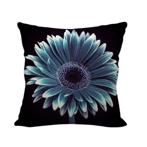 Linen pillowcase featuring a large blue daisy floral print on a dark black background