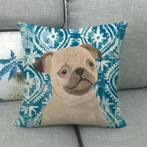 Linen pillow cover with pug illustration and geometric pattern on a grey sofa